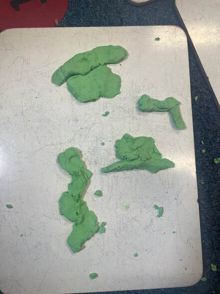 Picture of green playdough music notes and rests